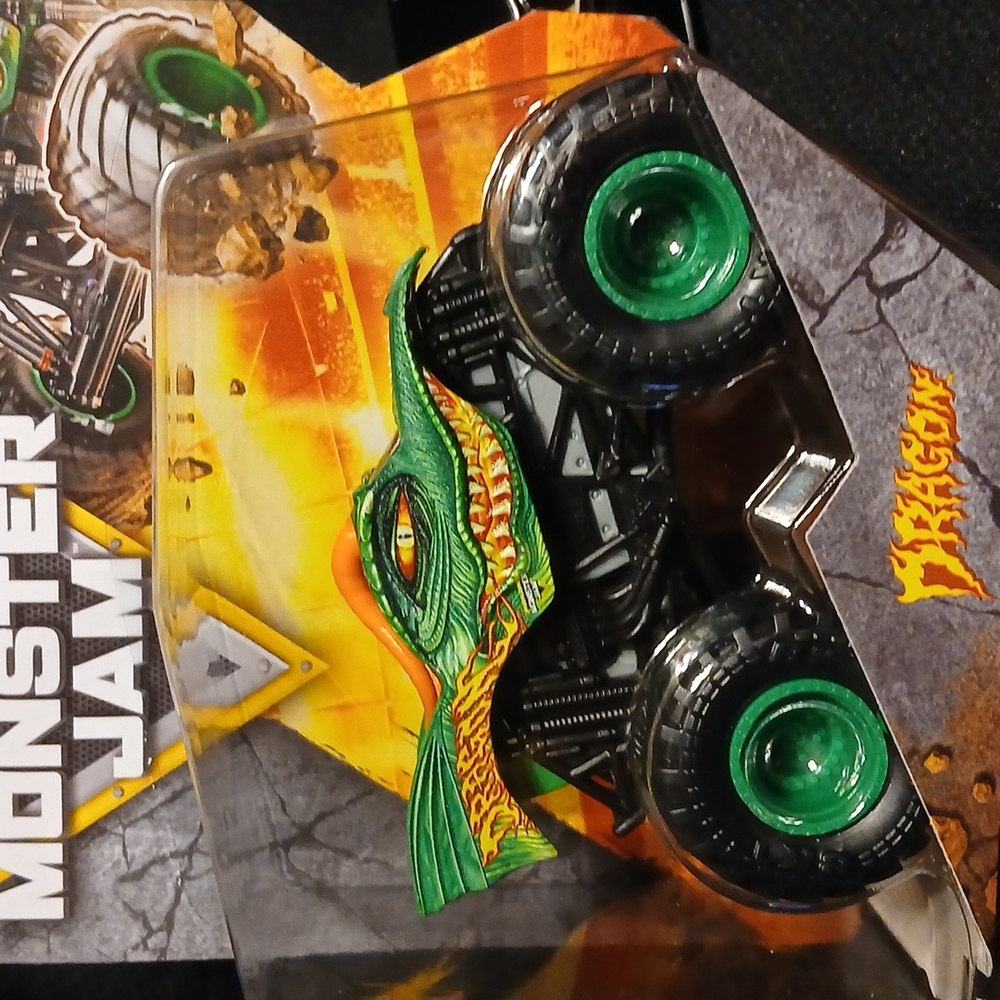 Monster Jam Dragon Toy Truck with Green and Orange Wheels 1/64